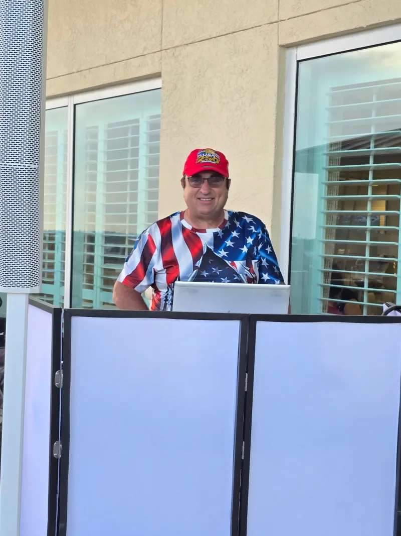 Our DJ keeping the energy high from the rooftop booth