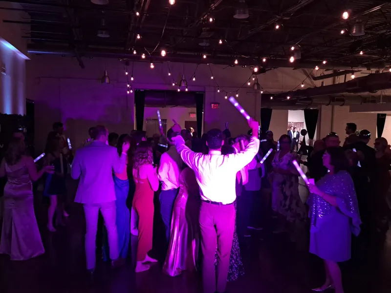 Guests dancing and laughing on the dance floor